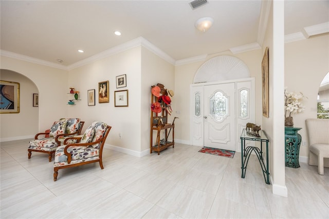 entryway featuring ornamental molding