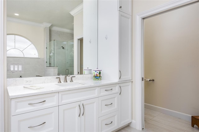 bathroom featuring tile patterned flooring, ornamental molding, vanity, and walk in shower