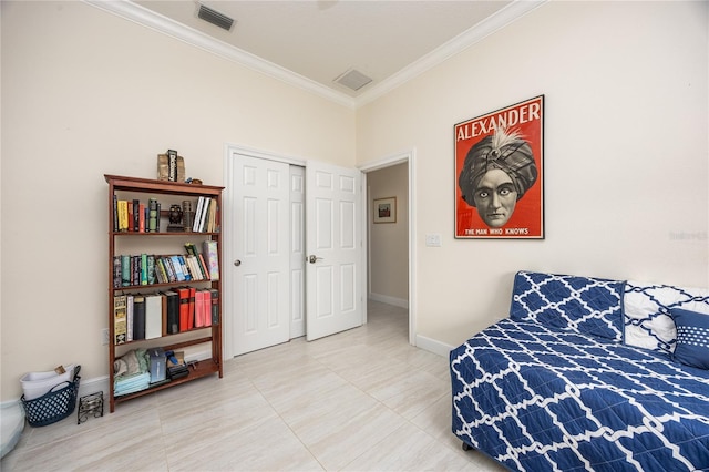 tiled bedroom featuring ornamental molding and a closet