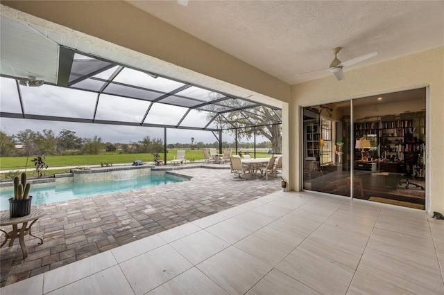 view of swimming pool featuring a lanai and a patio area