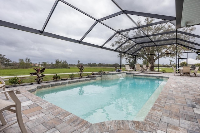 view of pool featuring a patio and glass enclosure