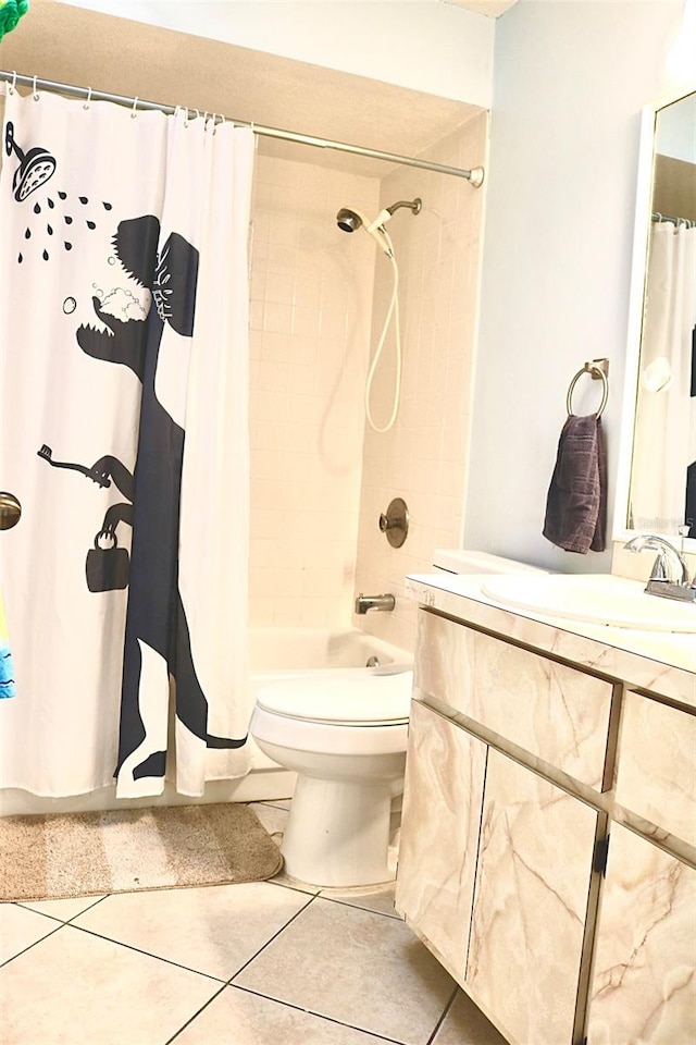 full bathroom featuring tile patterned flooring, vanity, toilet, and shower / tub combo