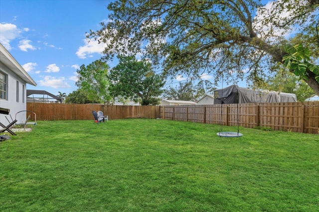 view of yard with a fenced backyard