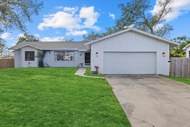 ranch-style home featuring a garage, concrete driveway, a front yard, and fence