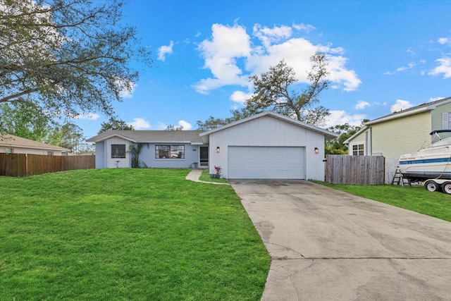 single story home with a garage, a front yard, driveway, and fence