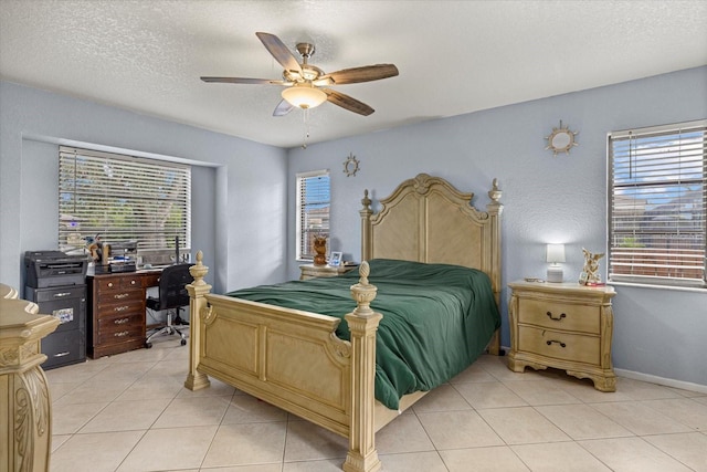 bedroom featuring a ceiling fan, a textured ceiling, and light tile patterned floors