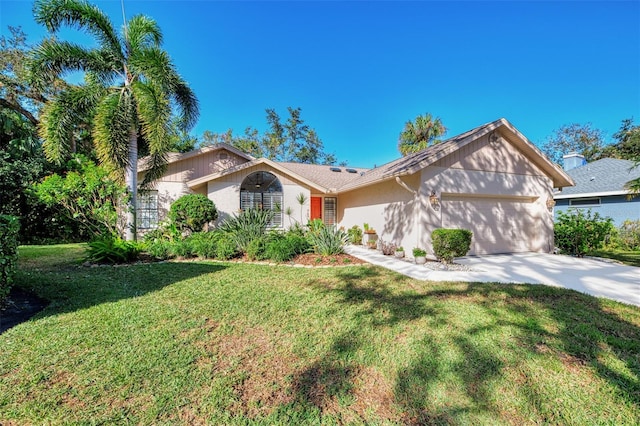 view of front facade with a front lawn and a garage