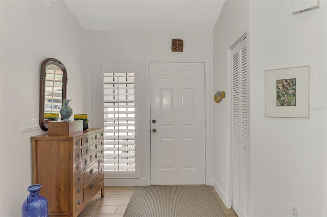 tiled entryway featuring a wealth of natural light