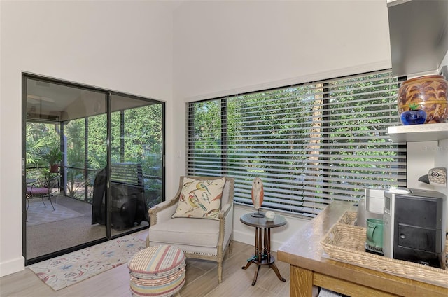 sitting room featuring light hardwood / wood-style floors