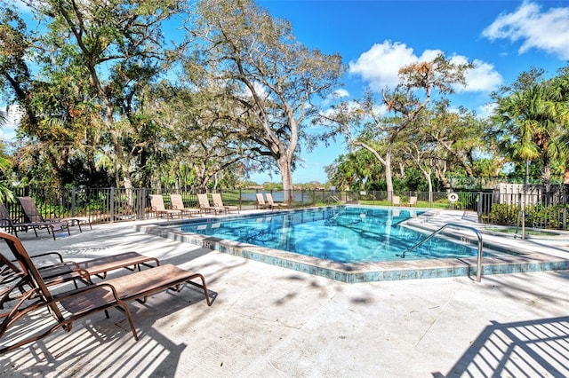 view of pool with a patio and a jacuzzi