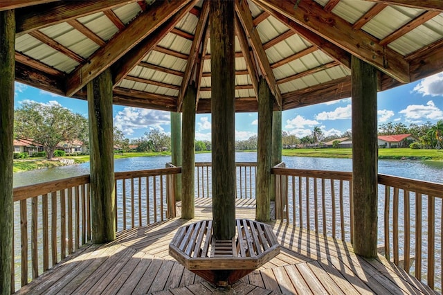 view of dock featuring a gazebo and a deck with water view