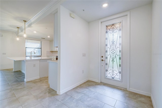 tiled entrance foyer with sink