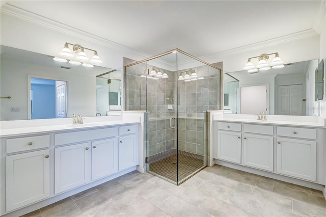 bathroom featuring crown molding, vanity, and an enclosed shower