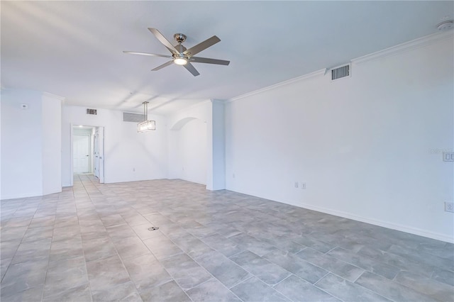 spare room with ceiling fan and crown molding