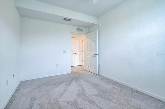 empty room with light colored carpet