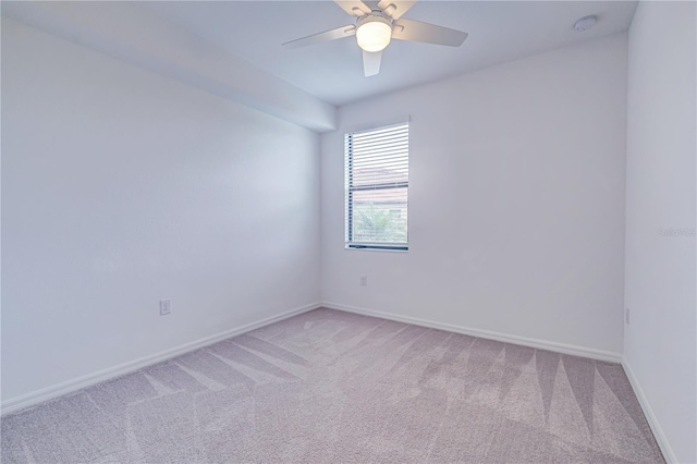 unfurnished room featuring light carpet and ceiling fan