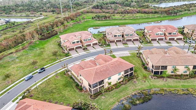 birds eye view of property featuring a water view