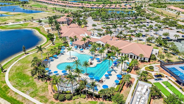 birds eye view of property with a water view