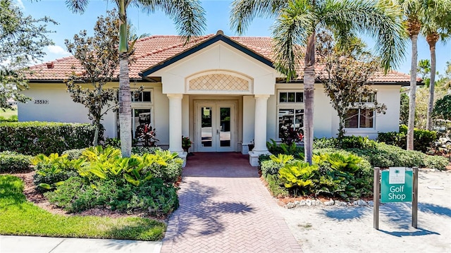 mediterranean / spanish-style house featuring french doors