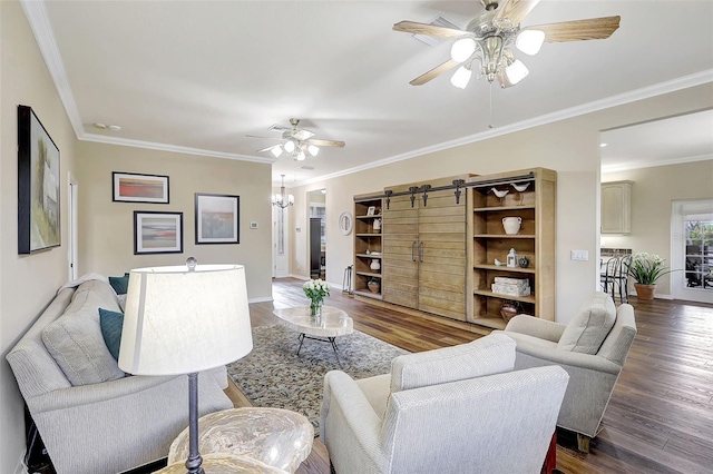 living room with ornamental molding, a barn door, ceiling fan, and dark hardwood / wood-style flooring