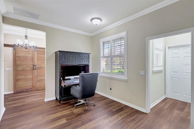 office featuring dark wood-type flooring, crown molding, a notable chandelier, and a barn door