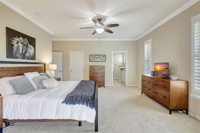 carpeted bedroom featuring crown molding, connected bathroom, and ceiling fan