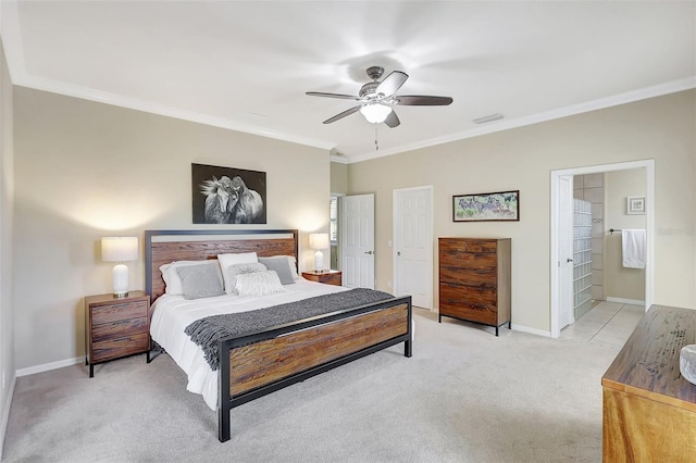 bedroom featuring ensuite bath, light carpet, ornamental molding, and ceiling fan