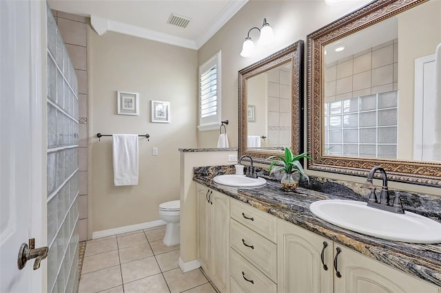 bathroom featuring vanity, crown molding, toilet, and tile patterned floors