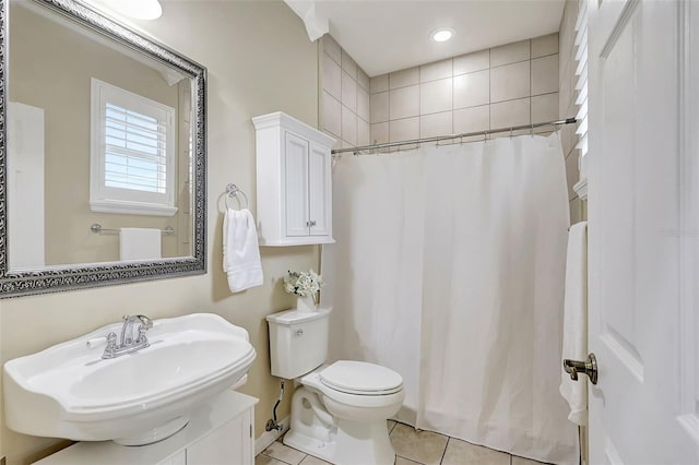 bathroom featuring vanity, toilet, tile patterned flooring, and a shower with shower curtain