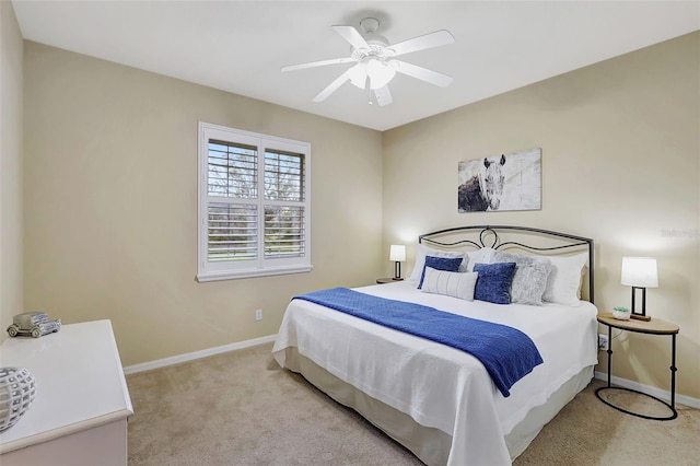 bedroom with light carpet and ceiling fan