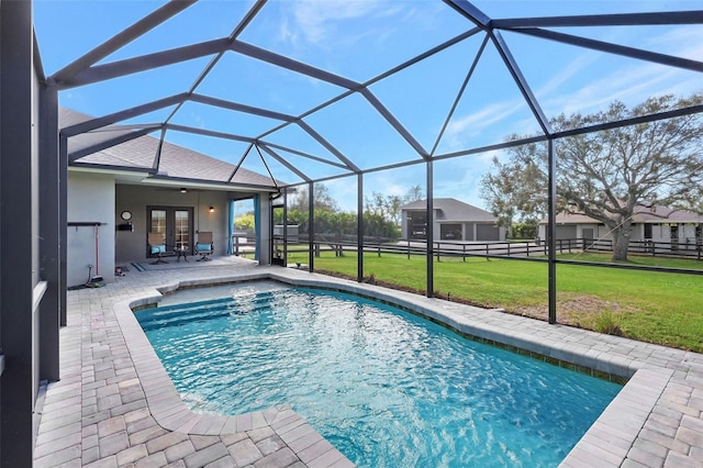 view of pool featuring a patio area, a lawn, and a lanai