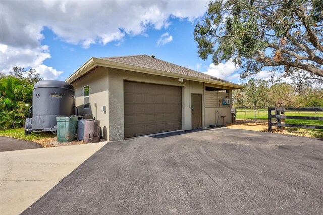 view of home's exterior with an outbuilding