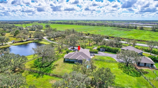 drone / aerial view featuring a rural view and a water view