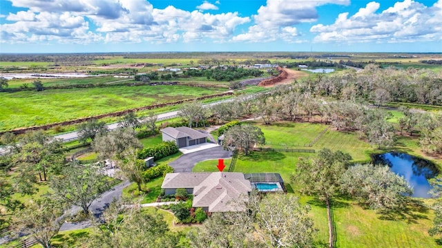 drone / aerial view with a water view and a rural view