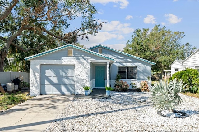 single story home featuring a garage