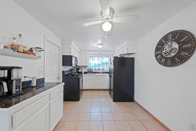 kitchen featuring black appliances, ceiling fan, white cabinetry, and light tile patterned floors