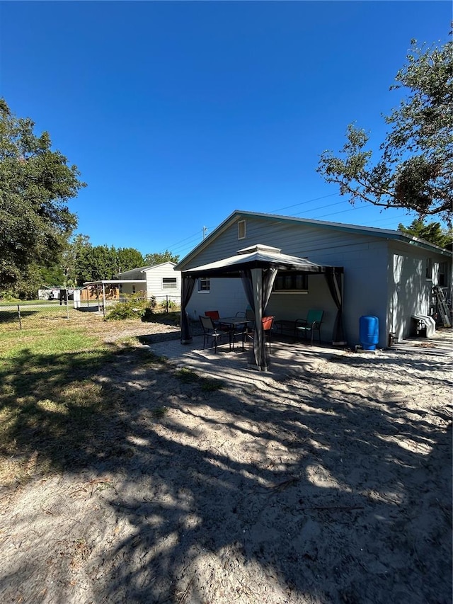 view of property exterior with a patio