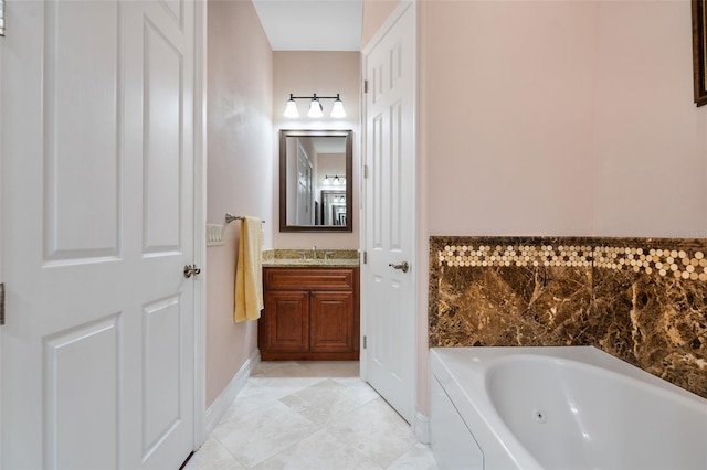 bathroom featuring a washtub, vanity, and tile patterned flooring