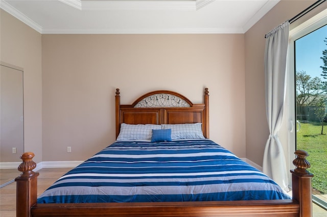 bedroom featuring light hardwood / wood-style floors and ornamental molding