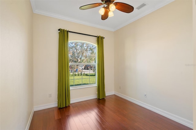 unfurnished room with ceiling fan, dark wood-type flooring, and ornamental molding