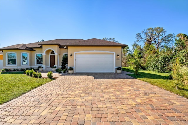 view of front of home featuring a garage and a front lawn