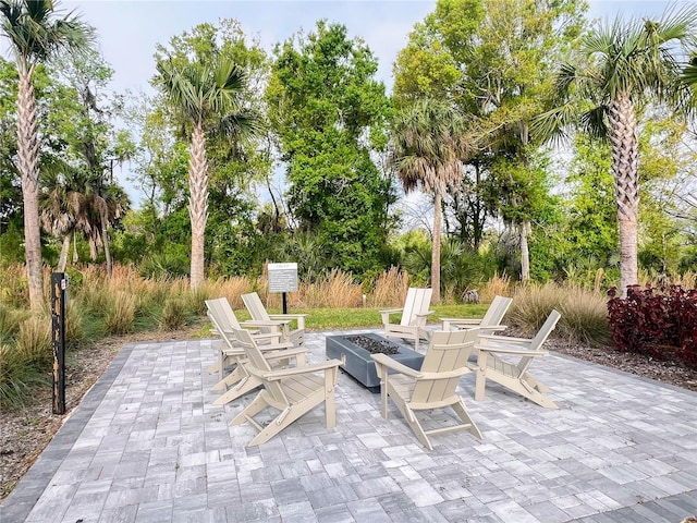 view of patio / terrace featuring an outdoor fire pit