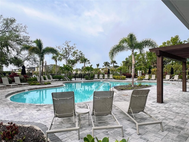 view of swimming pool featuring a patio area