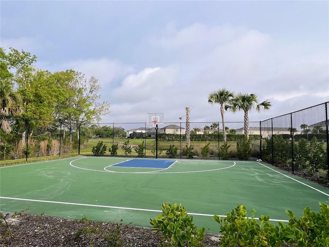 view of sport court featuring community basketball court and fence