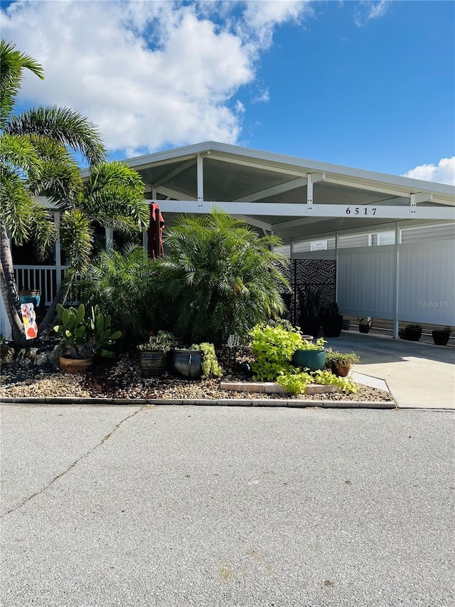 view of side of home featuring a carport