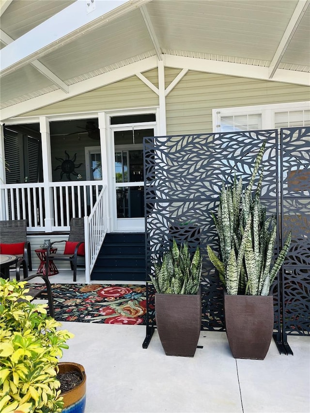 doorway to property with a patio area