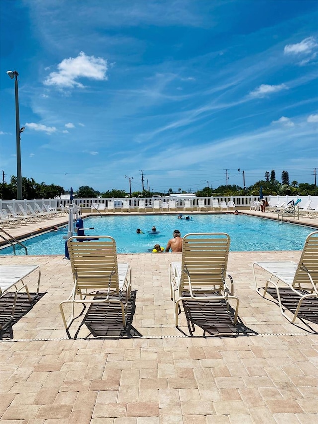 view of swimming pool featuring a patio