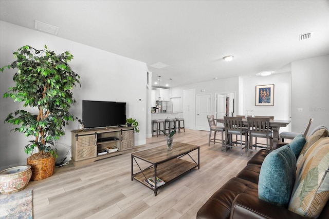 living room with light hardwood / wood-style floors