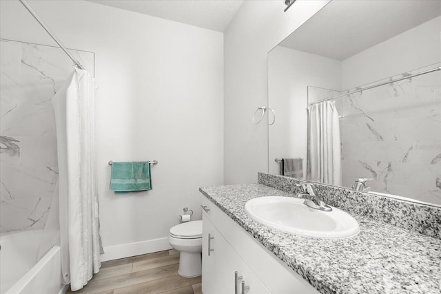 full bathroom with hardwood / wood-style floors, vanity, toilet, and shower / tub combo with curtain