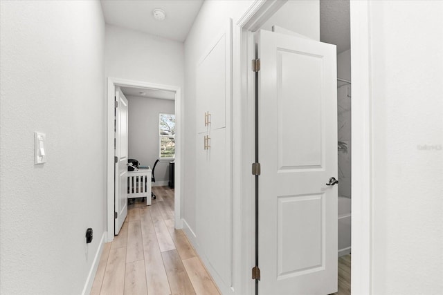 corridor featuring light hardwood / wood-style flooring